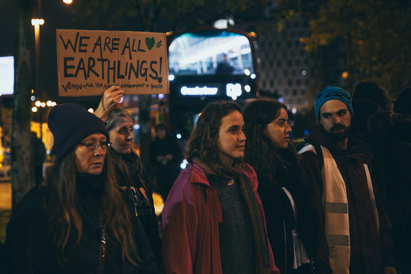 Activist Hold Ups A Sign Saying “We Are All Earthlings” At Fish Market Protest