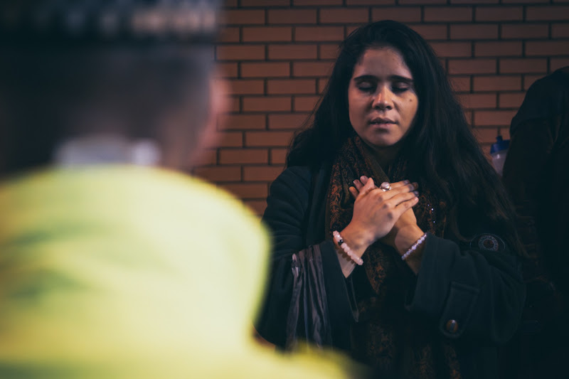 Activist Prays At Fish Market Protest